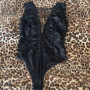 Black lace bodysuit. See-through from the back. Black/mesh. With tags! NEW